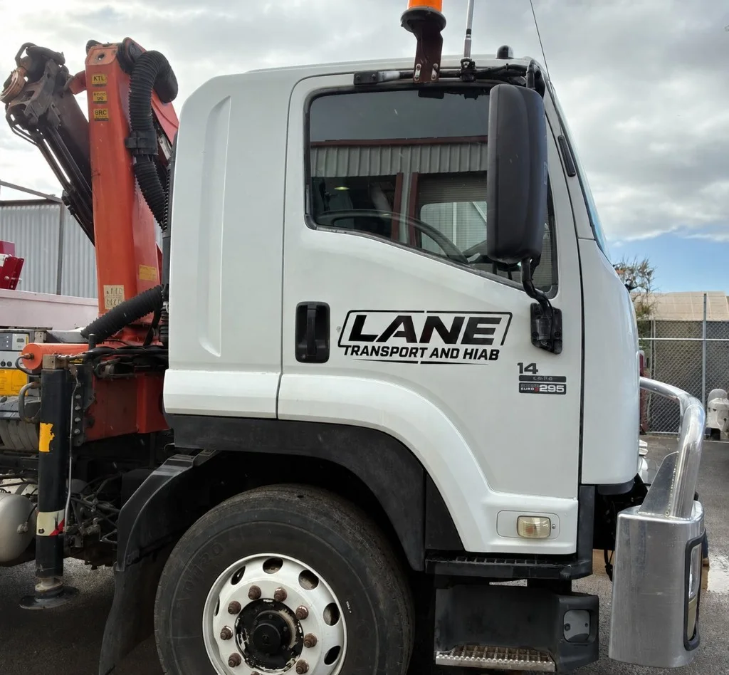 Lane Transport hiab truck cab with door branding and Palfinger crane